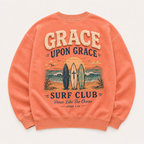 Coral crewneck with 'Grace Upon Grace Surf Club' design on a white background