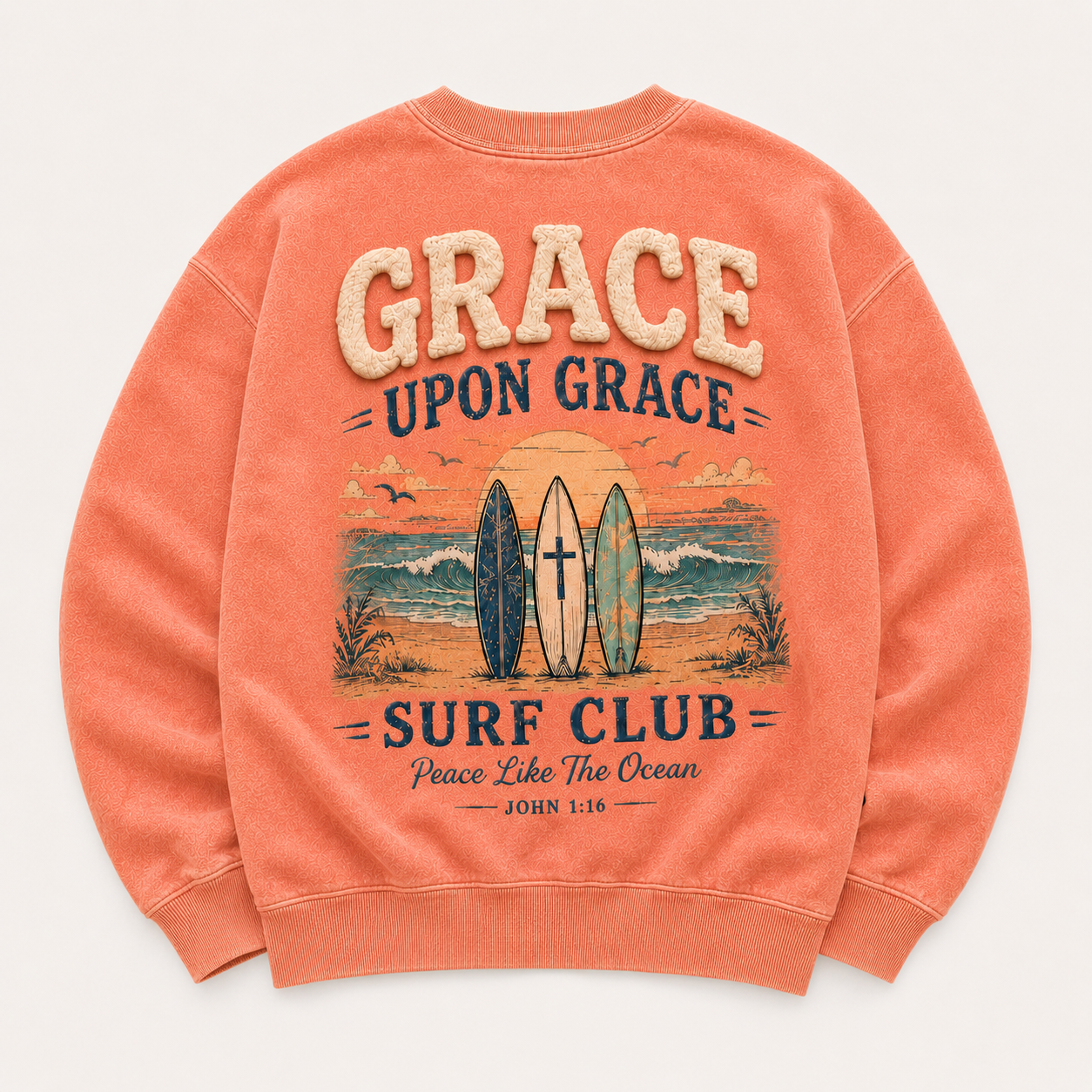 Coral crewneck with 'Grace Upon Grace Surf Club' design on a white background
