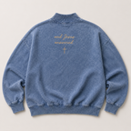 Blue sweatshirt with and Jesus answered text and cross on a light gray background