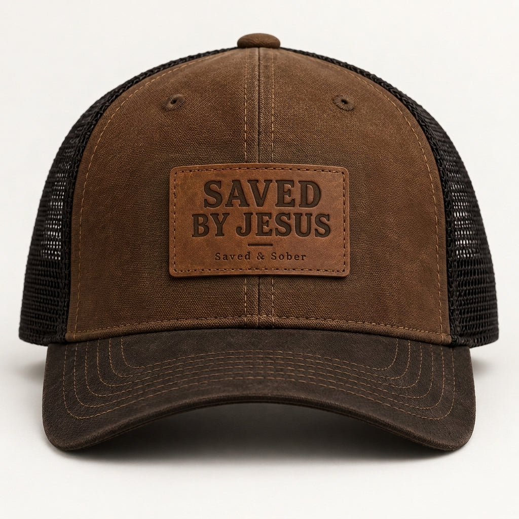 Brown black mesh trucker hat with brown stitched SAVED BY JESUS Saved & Sober leather-look patch